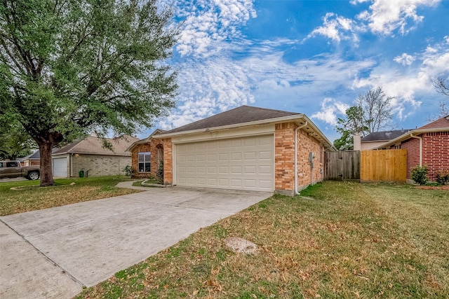 view of front of property featuring a garage and a front yard