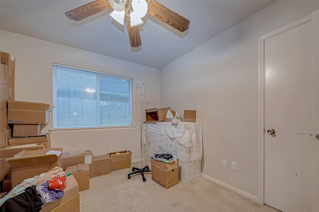 carpeted office featuring ceiling fan