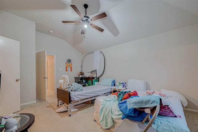 bedroom featuring ceiling fan, light carpet, and vaulted ceiling