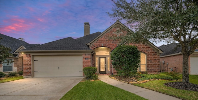 view of front of property with a garage