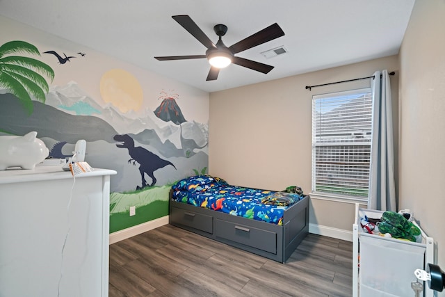 bedroom with dark wood-type flooring and ceiling fan