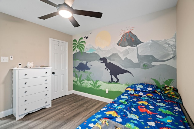 bedroom featuring ceiling fan and wood-type flooring