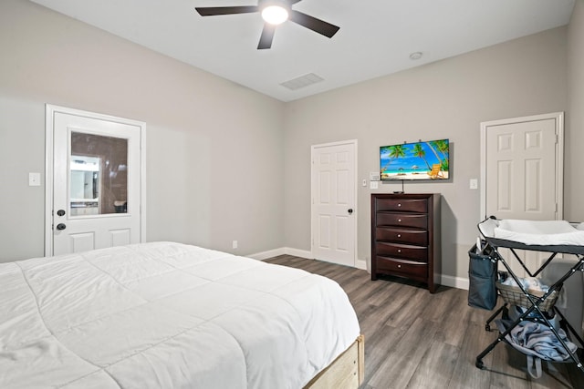 bedroom with dark wood-type flooring and ceiling fan