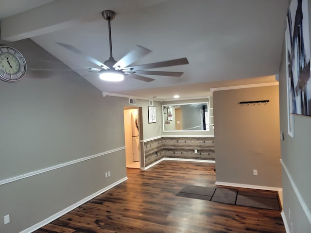 spare room featuring vaulted ceiling with beams, dark hardwood / wood-style floors, and ceiling fan