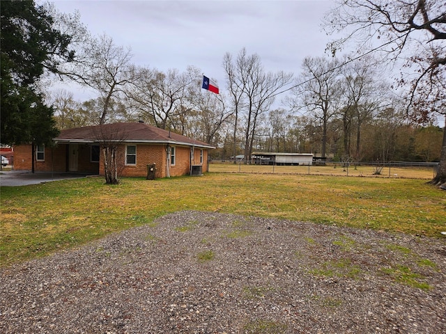 view of yard with central AC unit