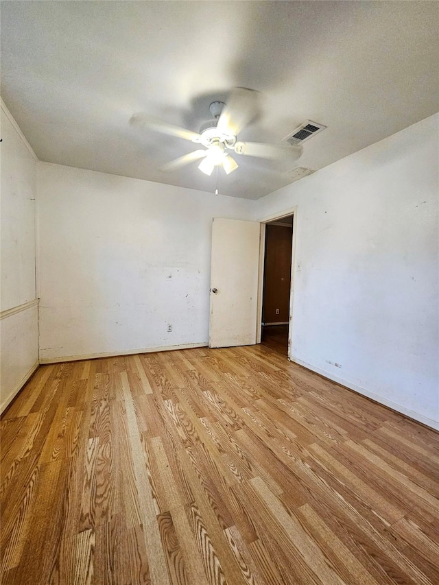 unfurnished room with ceiling fan and light hardwood / wood-style flooring