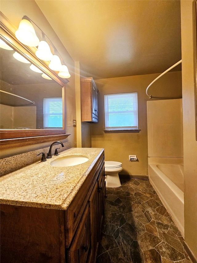 full bathroom with toilet, bathing tub / shower combination, and vanity