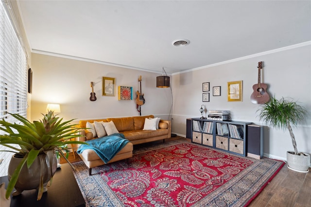 living room featuring wood-type flooring and ornamental molding