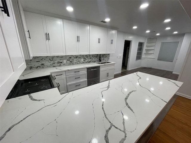 kitchen with light stone countertops, white cabinetry, dishwasher, and dark hardwood / wood-style flooring