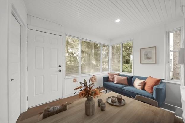 living room with wooden ceiling and a healthy amount of sunlight