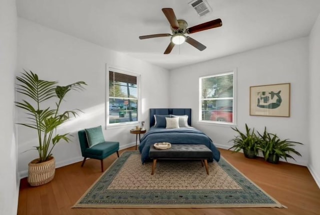 sitting room featuring hardwood / wood-style flooring and ceiling fan