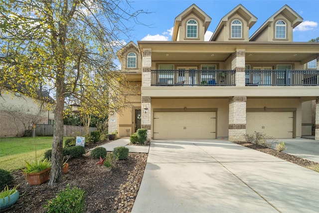 view of front of house featuring a garage and a balcony