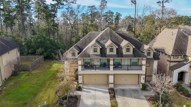 view of front of property featuring a garage and a front yard