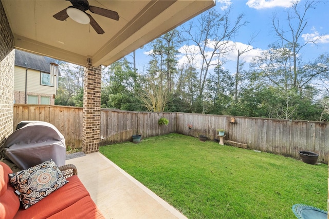 view of yard with a patio and ceiling fan