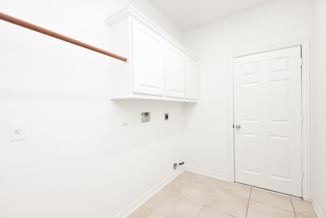 laundry area with light tile patterned floors, electric dryer hookup, hookup for a gas dryer, hookup for a washing machine, and cabinets