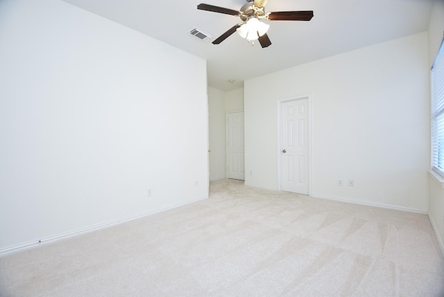 carpeted empty room with ceiling fan