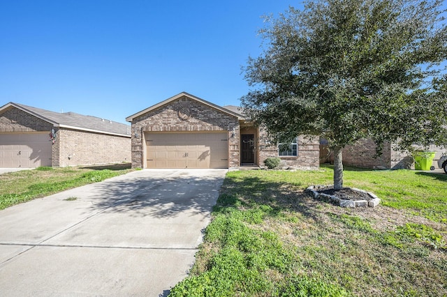 view of front of house featuring a front lawn and a garage