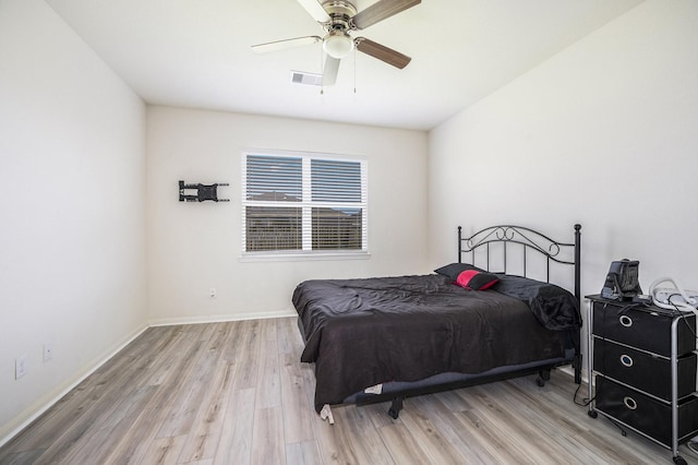 bedroom with ceiling fan and light hardwood / wood-style flooring