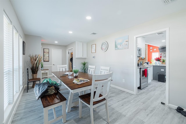 dining room featuring light hardwood / wood-style flooring