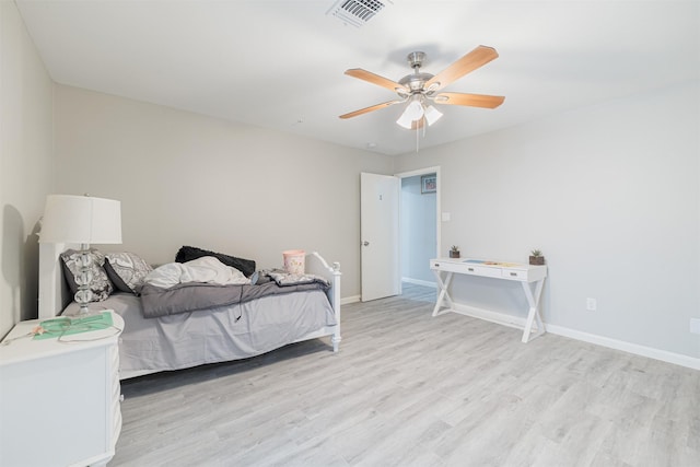 bedroom featuring light wood-type flooring and ceiling fan