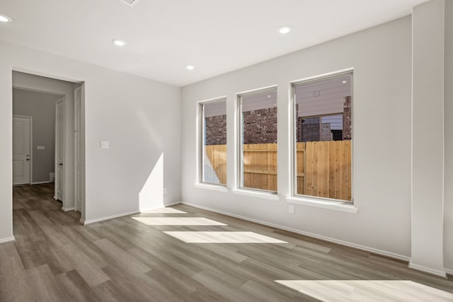 spare room featuring light hardwood / wood-style flooring