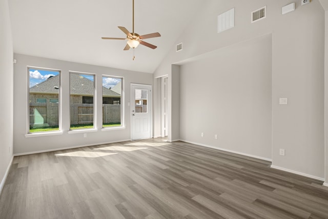 unfurnished living room featuring ceiling fan, hardwood / wood-style flooring, and high vaulted ceiling