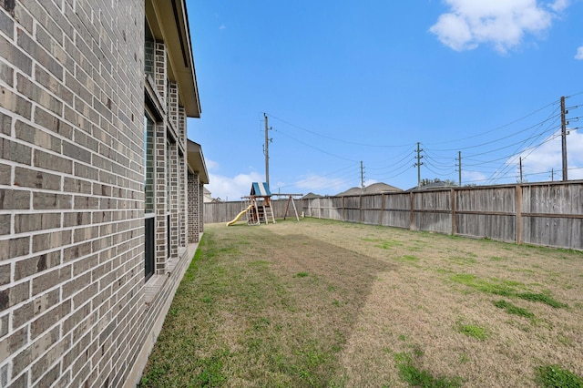 view of yard with a playground