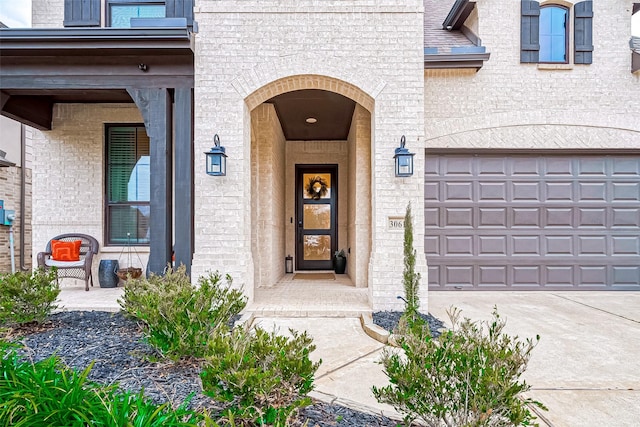 doorway to property with a garage