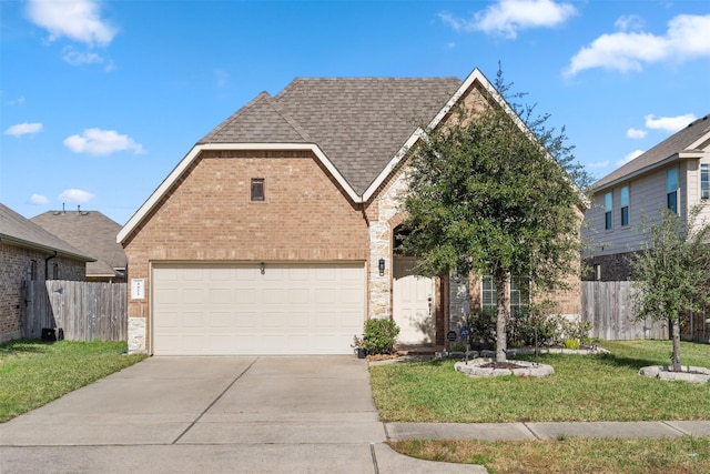 view of front property with a front lawn and a garage