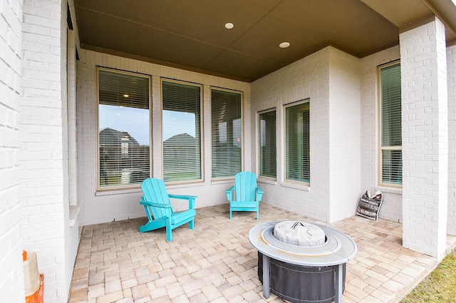 view of patio / terrace with a fire pit