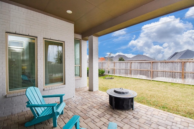 view of patio with a fire pit