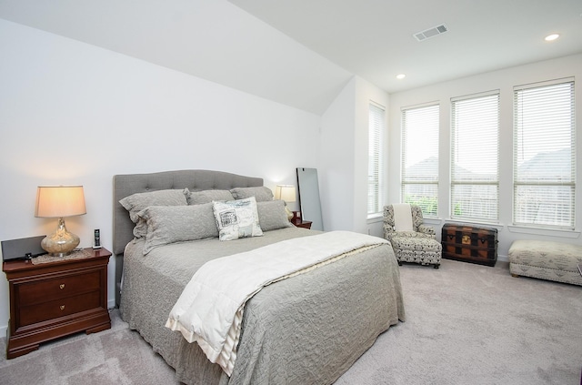 carpeted bedroom featuring vaulted ceiling