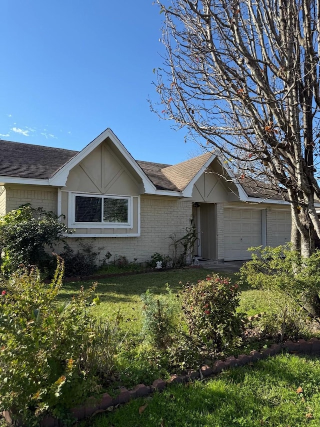 ranch-style house featuring a garage and a front yard