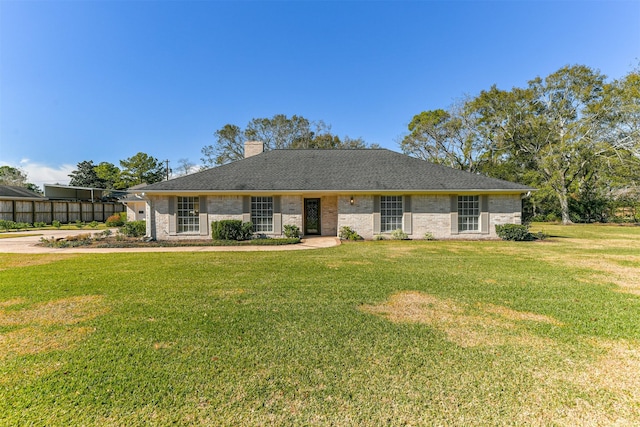 ranch-style house with a front lawn