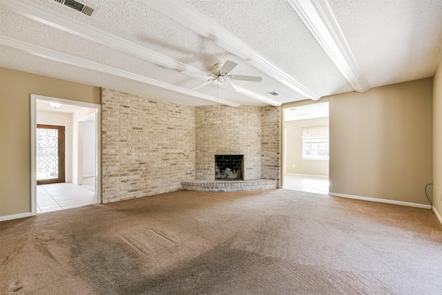 unfurnished living room with a brick fireplace, a textured ceiling, light carpet, and ceiling fan