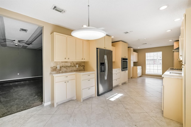 kitchen with ceiling fan, light colored carpet, tasteful backsplash, hanging light fixtures, and appliances with stainless steel finishes