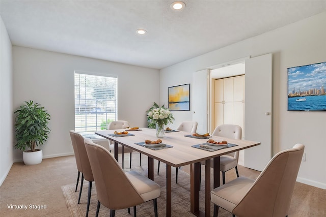 view of carpeted dining space