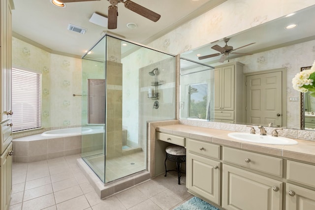 4 Mariners Ln, Kemah, TX 77565 - full bath with ceiling fan, tile patterned floors, a shower stall, wallpapered walls, and ornamental molding