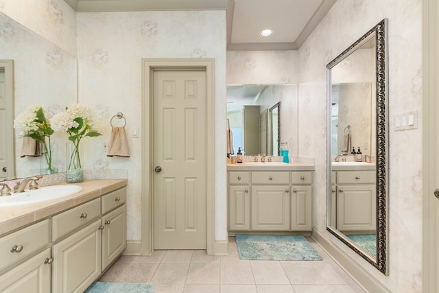4 Mariners Ln, Kemah, TX 77565 - bathroom featuring two vanities and tile patterned flooring