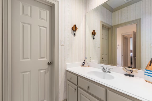 4 Mariners Ln, Kemah, TX 77565 - bathroom with wallpapered walls and vanity