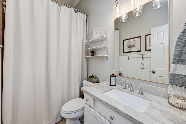 bathroom with toilet and vanity