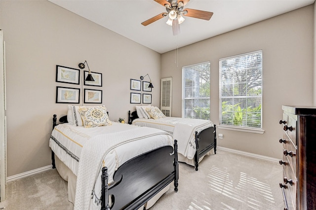 bedroom featuring ceiling fan and light colored carpet