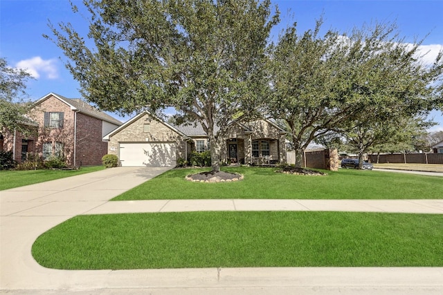 view of front of house featuring a garage and a front lawn