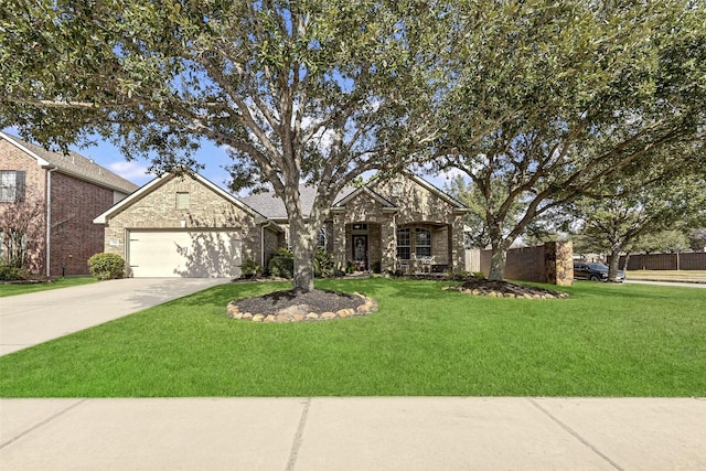 view of front of home featuring a garage and a front lawn