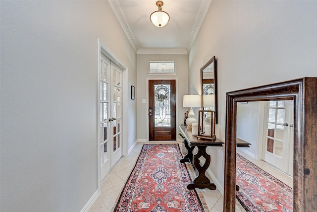 tiled entrance foyer featuring french doors and crown molding