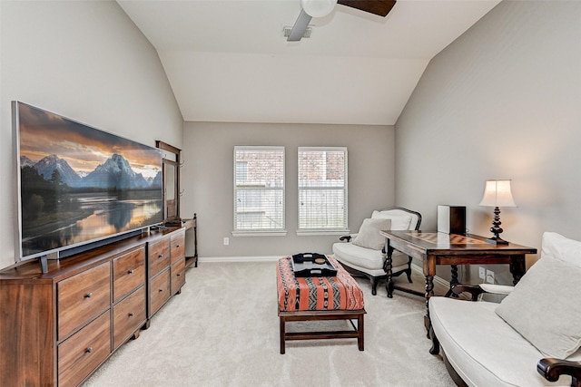 sitting room featuring vaulted ceiling, ceiling fan, and light carpet