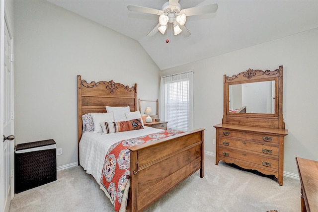 bedroom featuring light colored carpet, vaulted ceiling, and ceiling fan