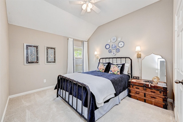 carpeted bedroom featuring ceiling fan and lofted ceiling