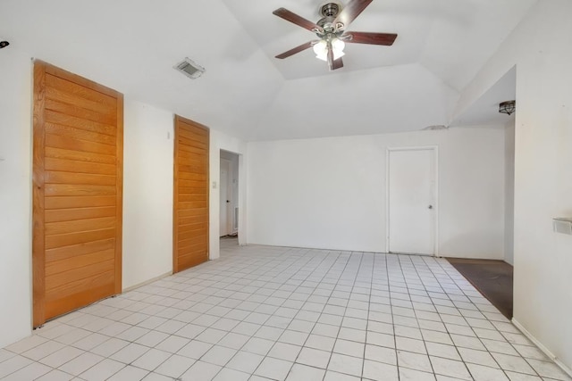 tiled spare room with ceiling fan and lofted ceiling