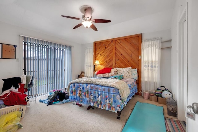 bedroom with ceiling fan and carpet flooring